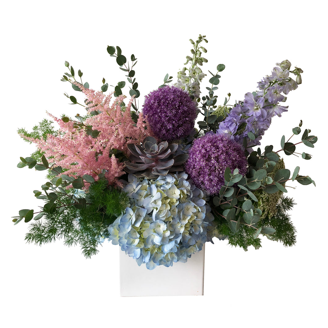 A modern assortment featuring pink astilbe flowers, blue hydrangea, purple allium, violet delphinium arranged in Flower Studio signature style.